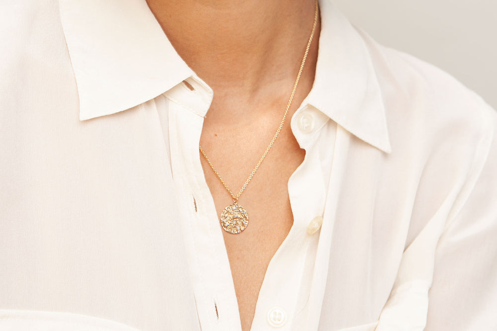 Lady Wearing Mineral and Diamond Medallion Necklace in 14K Gold